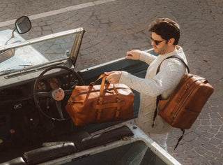 Brown leather duffel bag and backpack