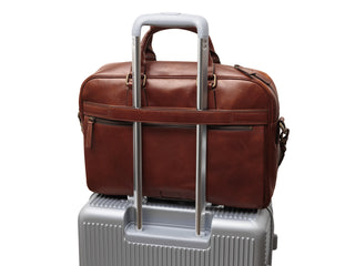 Single Gusset Stringer Bag on suitcase handle